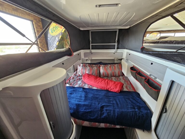 Cozy insulated double bed setup inside the Echo Kavango caravan, perfect for winter overlanding comfort